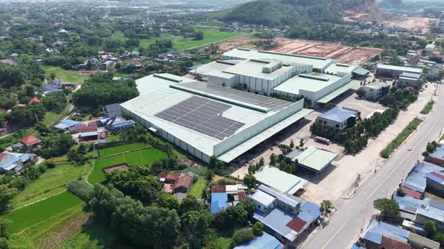Aerial Factory Among Rice Fields