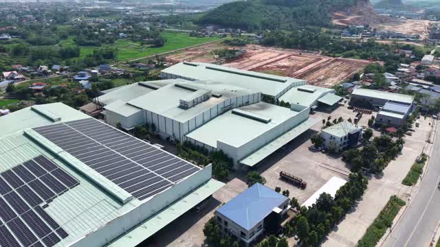 Close Aerial Factory Solar Roof