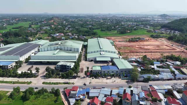 Aerial Factory Amid Rice Fields