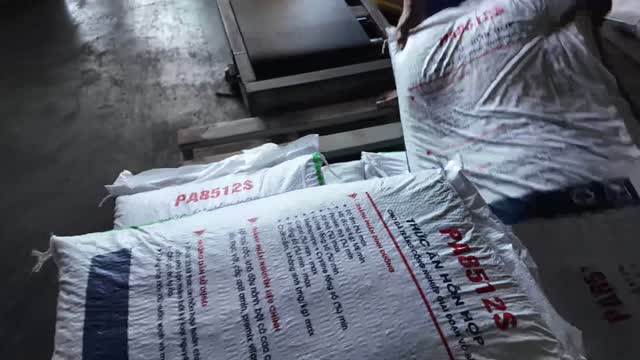 Handling Animal Feed Sacks