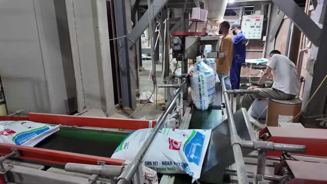 Workers Packing Animal Feed