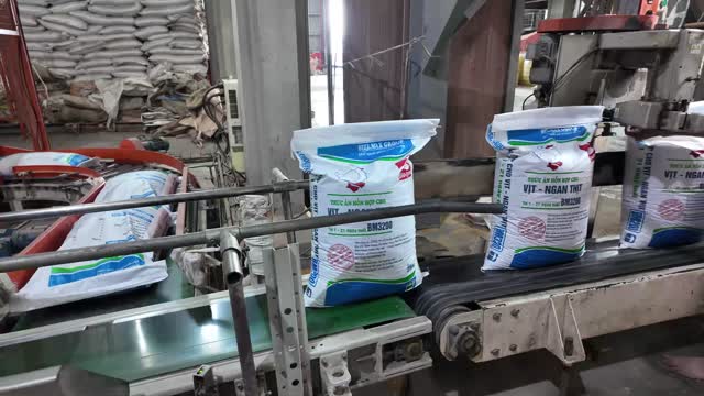 Feed Sacks Moving Down Line