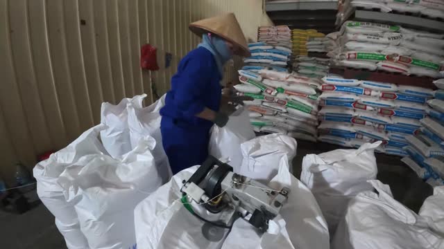 Bag Sewing In Feed Store