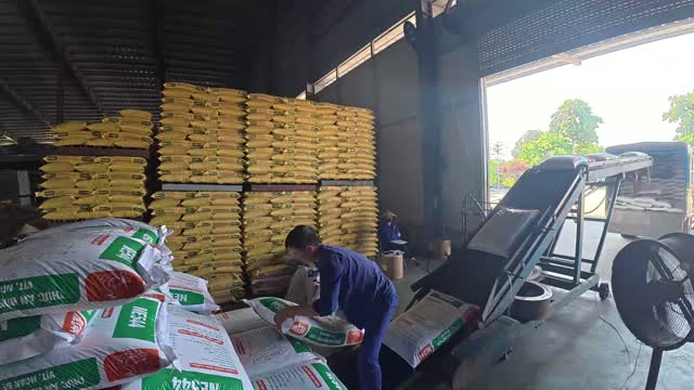 Loading Sacks By Warehouse Door