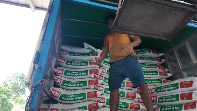 Unloading Feed Bags From Truck