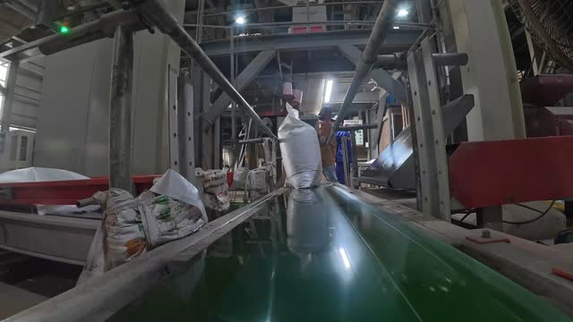 Moving Sacks On Conveyor