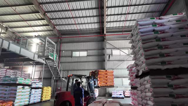 Forklift In Feed Storage Warehouse