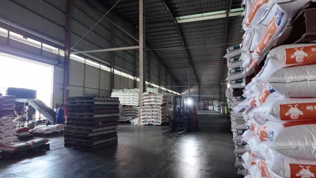 Stacked Feed Sacks In Warehouse