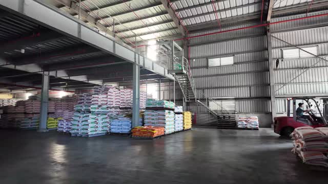 Feed Sacks Stacked In Warehouse