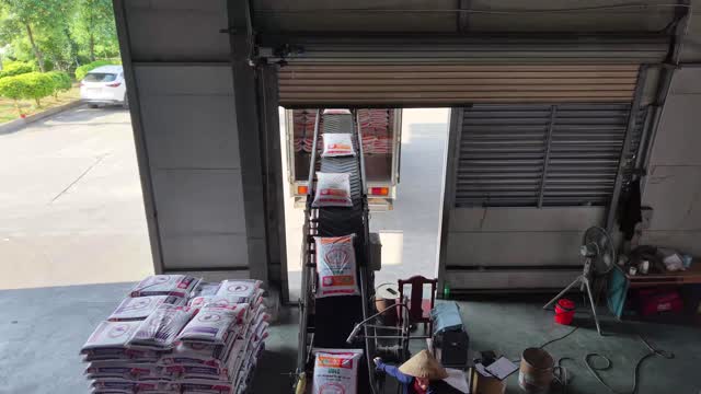 Loading Feed Bags Onto Truck
