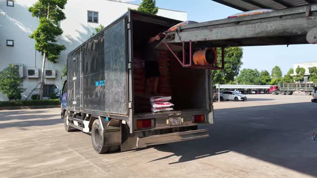 Loading Feed Truck In Yard