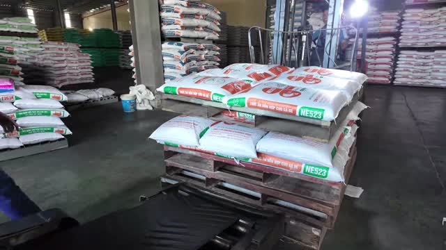 Close-Up Of Feed Sacks On Pallet