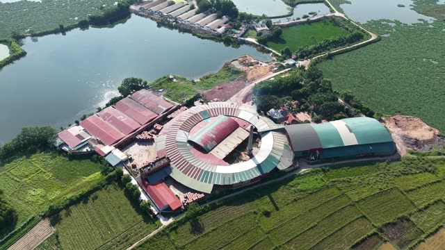 Aerial Rural Factory By Lake