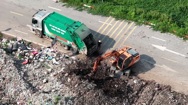 Garbage Truck Dumping Waste