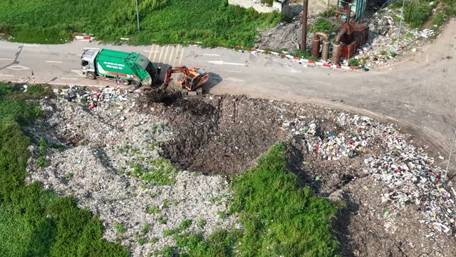 Landfill Excavator And Truck