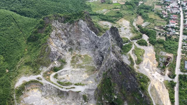 Quarry Cliffs And Winding Tracks