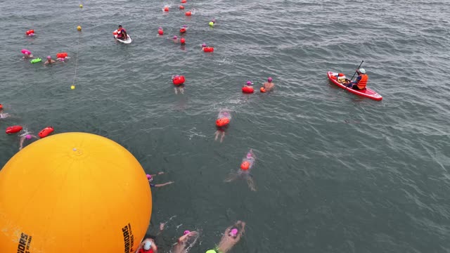 Swimmers Pass Giant Buoy
