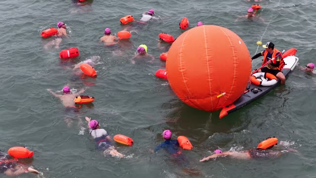 Crowd Turning At Buoy