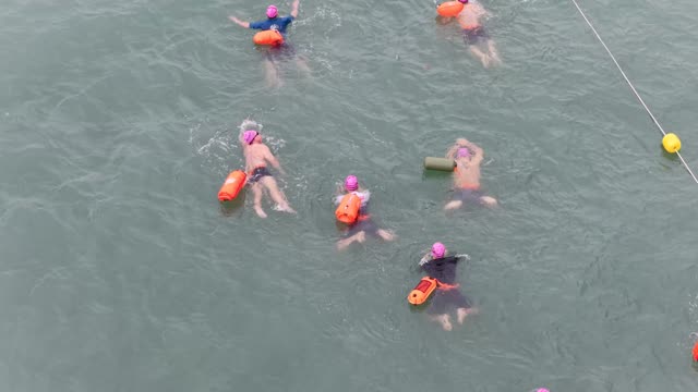 Close Swimmers With Floats