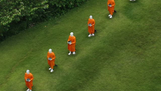 Monk Statues With Alms Bowls