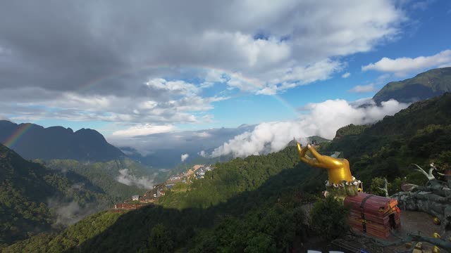 Golden Hand Statue Above Cloud Sea