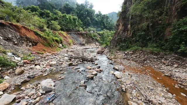 Rocky Stream Below Red Cliffs