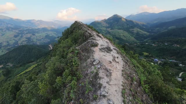 Rocky Peak Amid Green Mountains