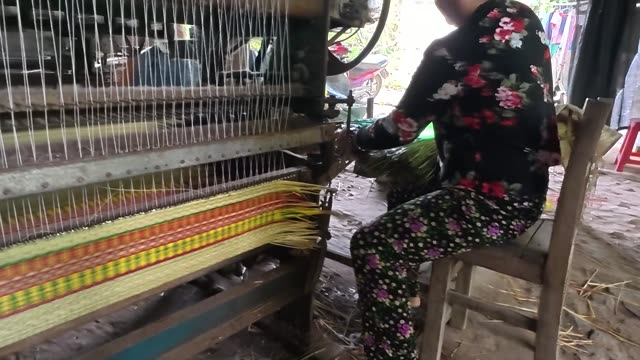 Weaving A Sedge Mat On A Loom