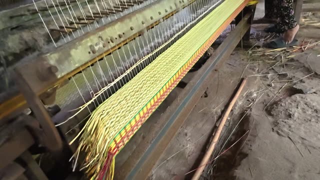 Weaving A Sedge Mat On A Loom