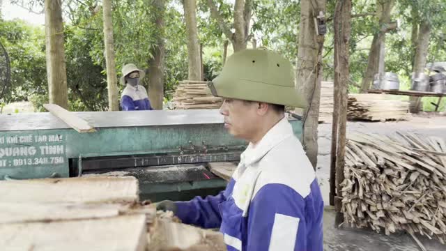 Worker At Green Resaw Machine