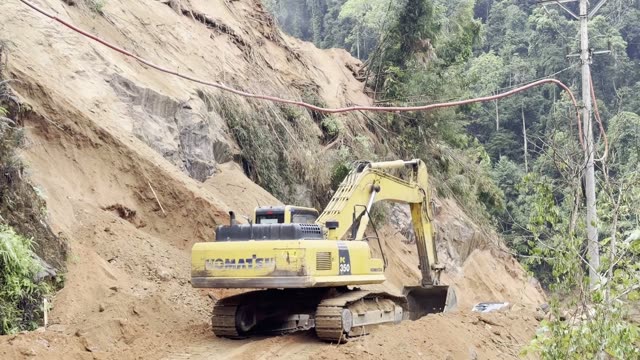 Excavator Digging Landslide Slope