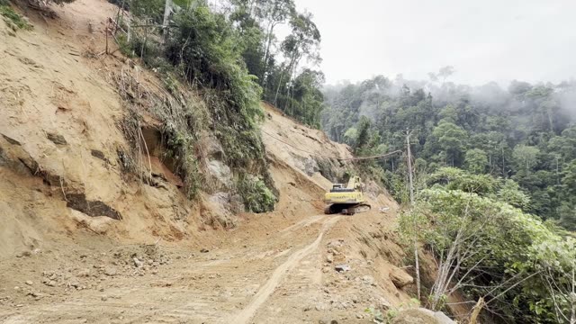 Excavator On Landslide Slope