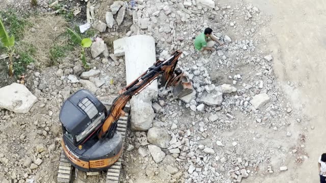 Excavator Breaking Concrete