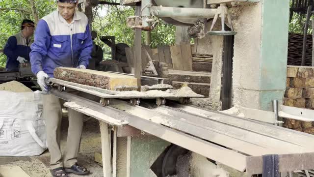 Feeding Log Into Bandsaw