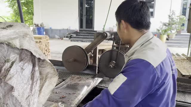 Worker At Twin Blade Saw