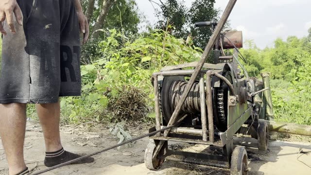 Worker By Cable Winch