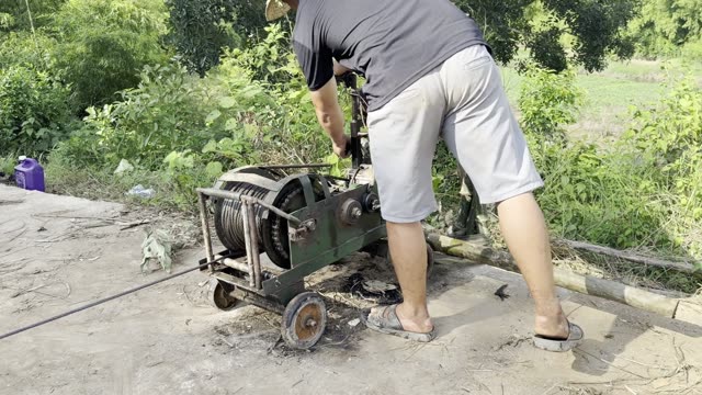 Man Working The Winch