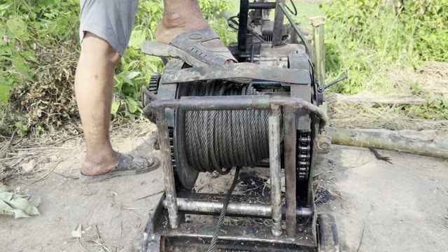 Foot On The Winch Drum