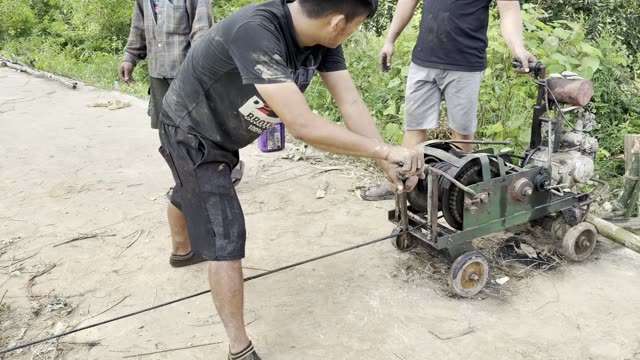 Two Men Run The Winch