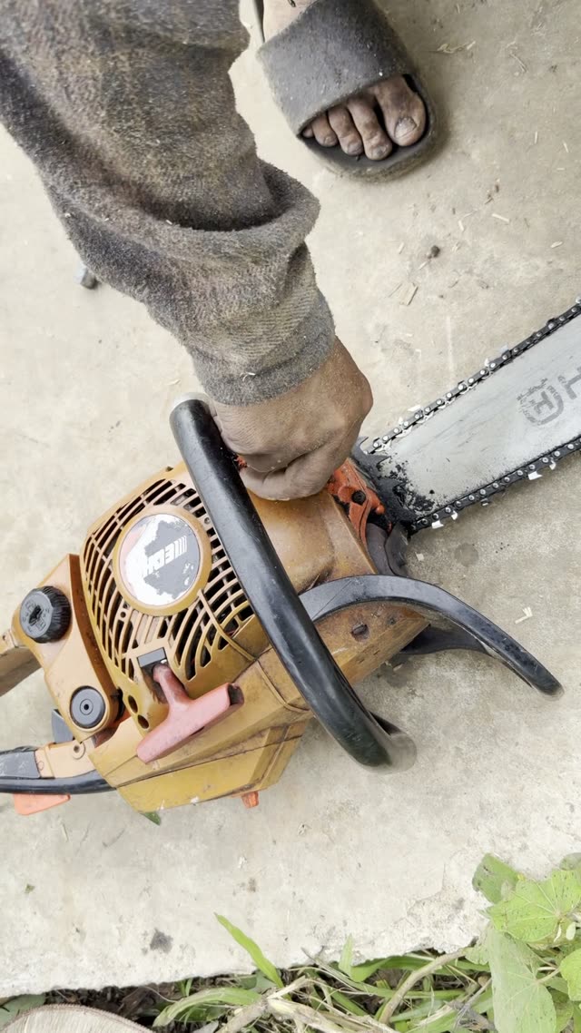 Gripping The Chainsaw