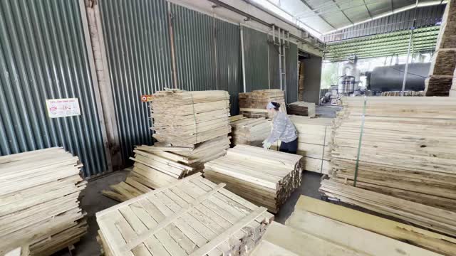 Stacking Wood In Warehouse