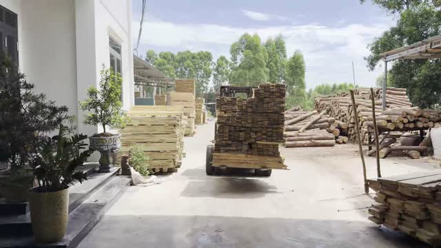 Forklift Moving Timber Stack
